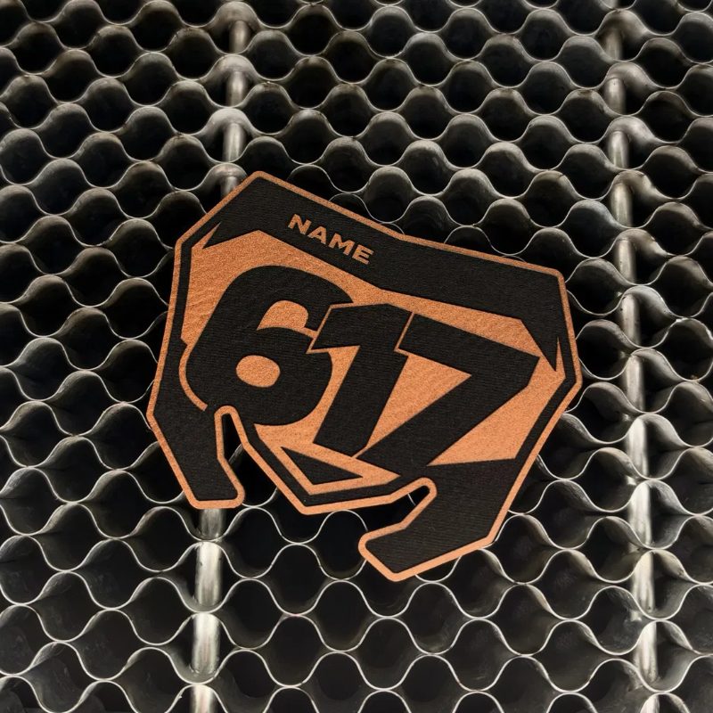 Tan leatherette number plate patch on the laser bed