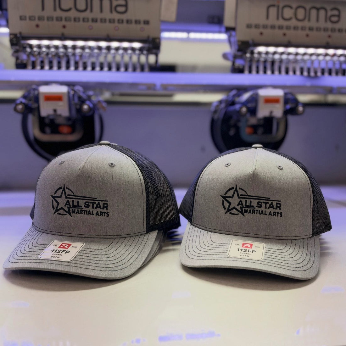 Grey Richardson 112FP truckers with a black embroidered All Star Martial Arts logo