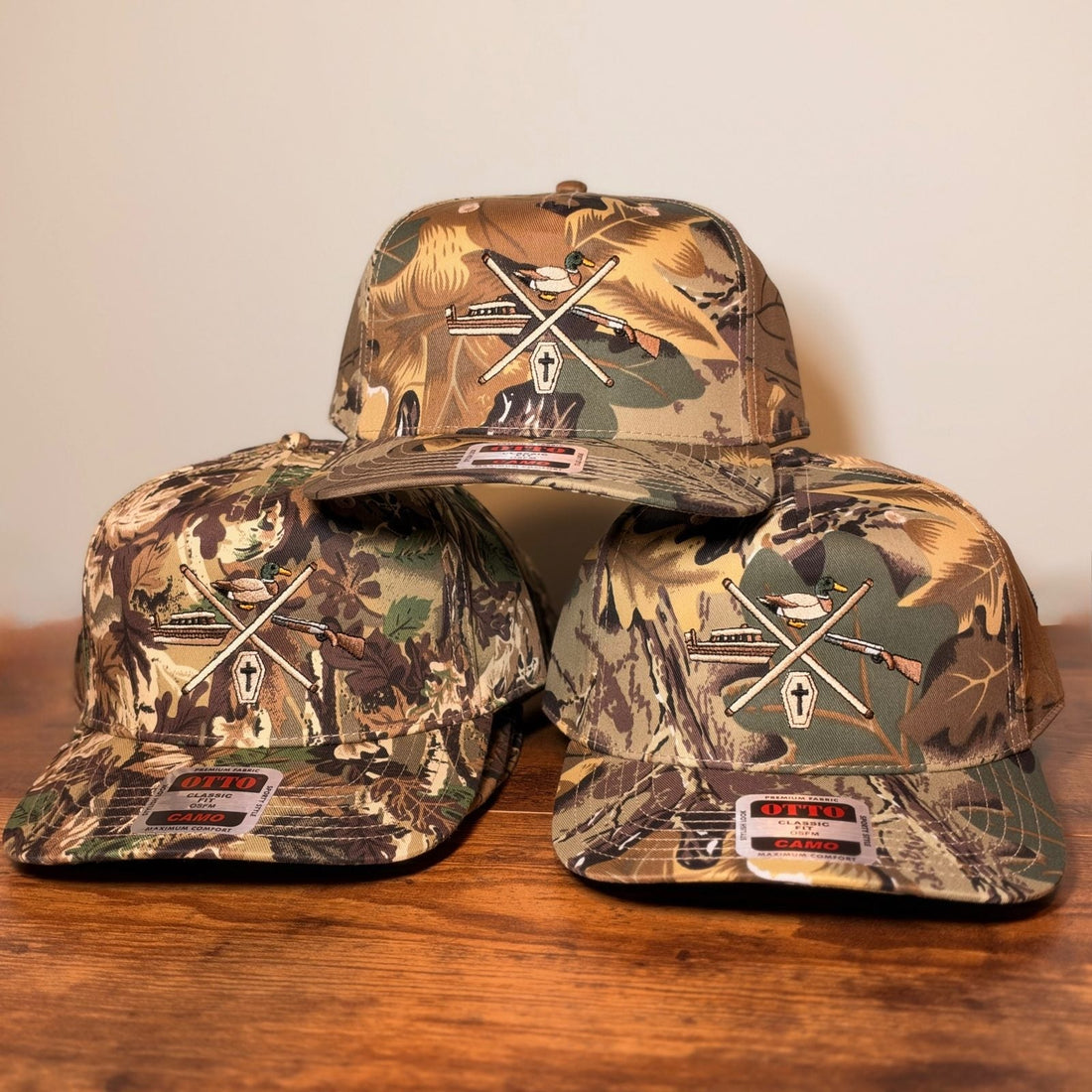 Otto camo snapbacks with a detailed multi-color embroidered duck hunting logo