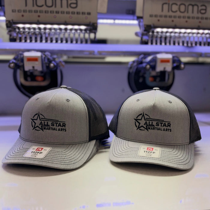 Grey Richardson 112FP truckers with a black embroidered All Star Martial Arts logo